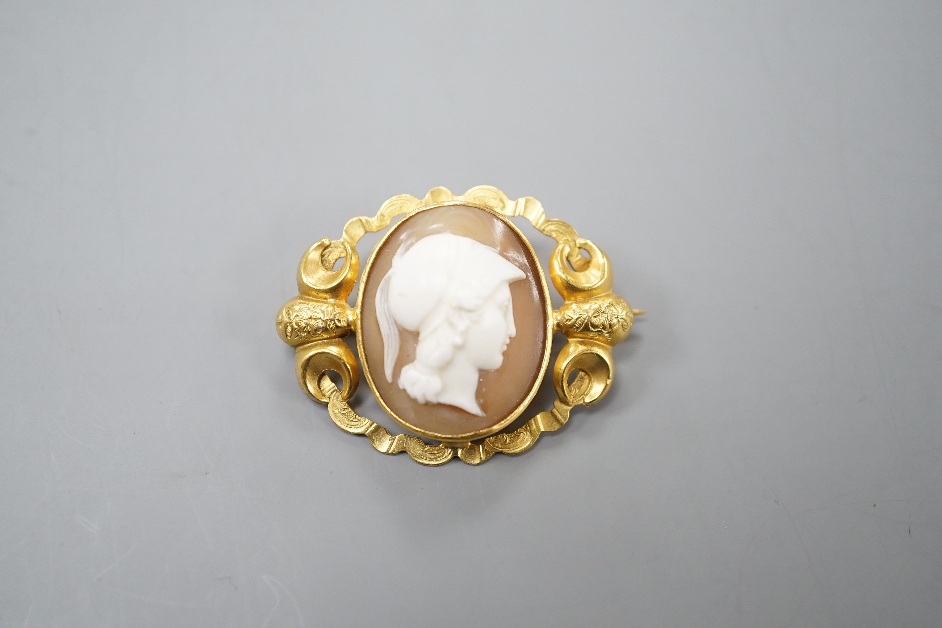 An early 20th century yellow metal mounted oval cameo shell brooch, carved with with the bust of a gentleman to sinister, 37mm, gross 7.6 grams.